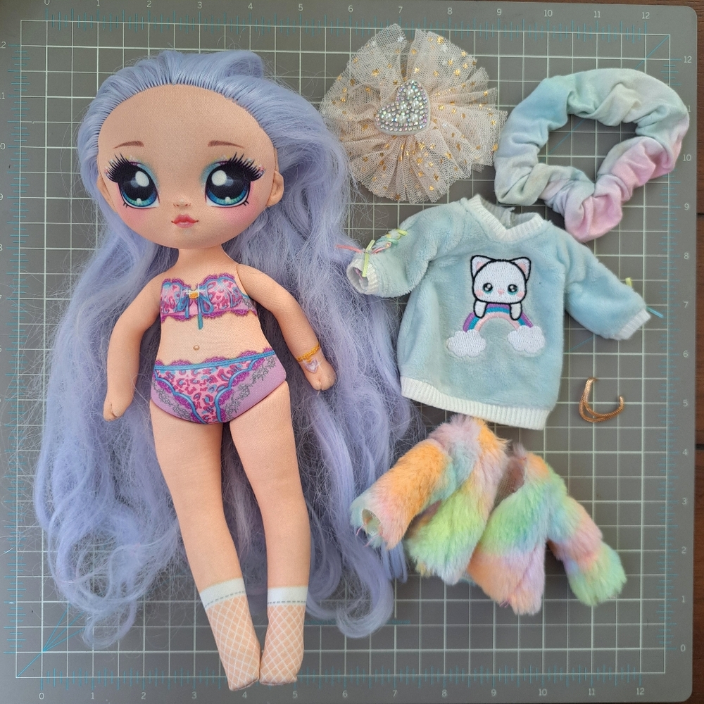 Na! Na! Na! Surprise Ultimate Surprise Rainbow Kitty Doll with some accessories